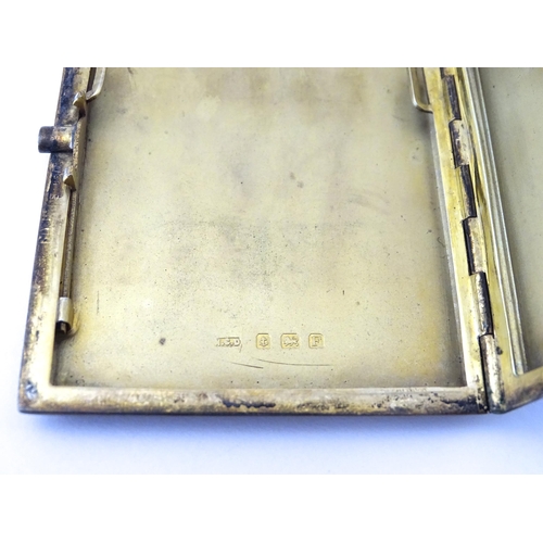 310 - An Art Deco silver cigarette case with blue guilloche enamel decoration and gilded interior, hallmar... 