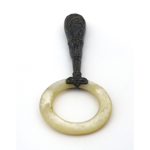 312 - A silver handled mother of pearl teething ring, the handle stamped sterling, with indistinct maker's... 