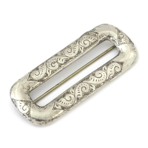 313 - A Victorian silver buckle with engraved decoration, hallmarked Chester 1898, maker Arthur Johnson Sm... 