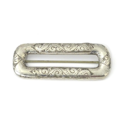 313 - A Victorian silver buckle with engraved decoration, hallmarked Chester 1898, maker Arthur Johnson Sm... 