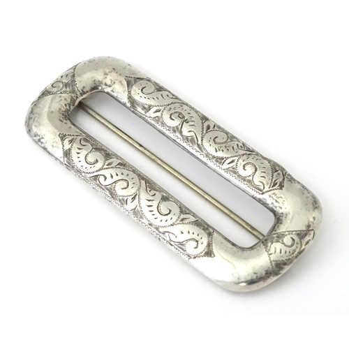 313 - A Victorian silver buckle with engraved decoration, hallmarked Chester 1898, maker Arthur Johnson Sm... 