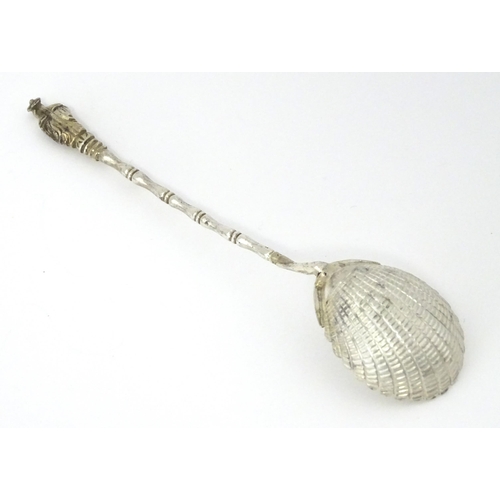 315 - A Chinese Export silver spoon with shell formed bowl and stylised bamboo handle surmounted by an Ori... 