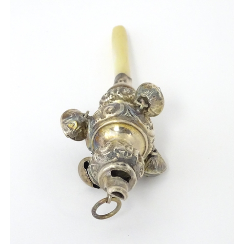 320 - A silver child's rattle with mother of pearl handle, hallmarked Birmingham 1912, maker George Unite.... 