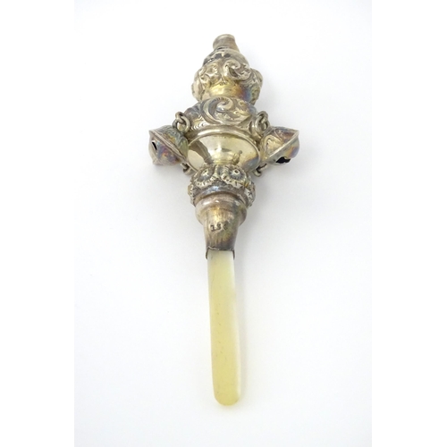 320 - A silver child's rattle with mother of pearl handle, hallmarked Birmingham 1912, maker George Unite.... 