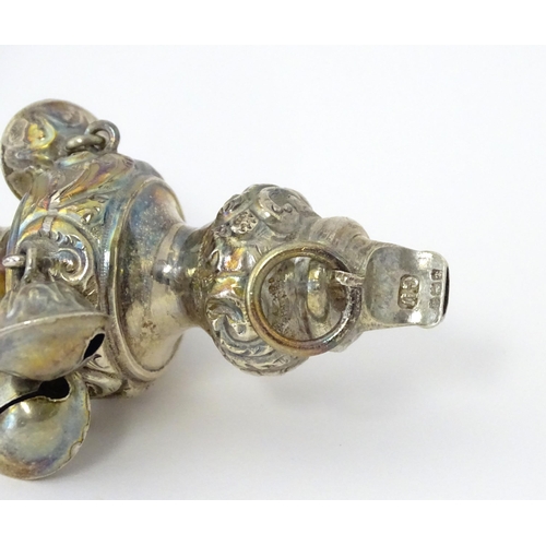 320 - A silver child's rattle with mother of pearl handle, hallmarked Birmingham 1912, maker George Unite.... 