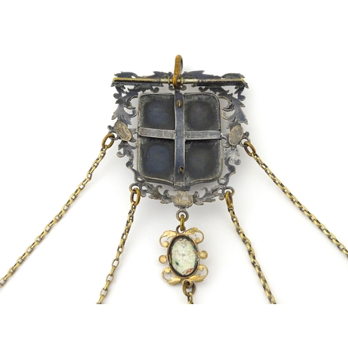 323 - A late 19th / early 20thC silver plate, gilt metal / white metal chatelaine decorated with hand pain... 