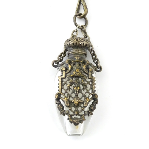 323 - A late 19th / early 20thC silver plate, gilt metal / white metal chatelaine decorated with hand pain... 