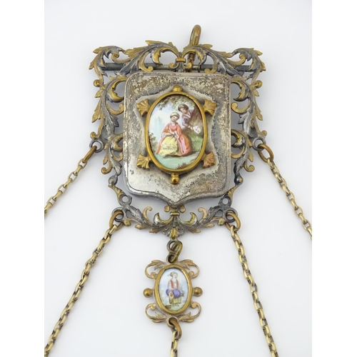 323 - A late 19th / early 20thC silver plate, gilt metal / white metal chatelaine decorated with hand pain... 