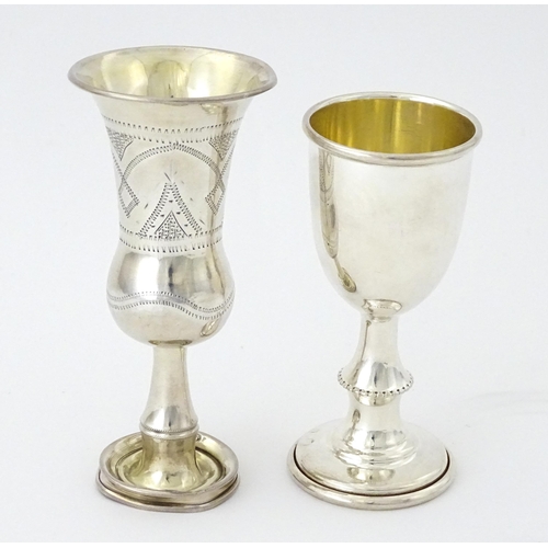 324 - A silver kiddush cup hallmarked Birmingham 1910, maker Jacob Fenigstein. Together with a silver pede... 