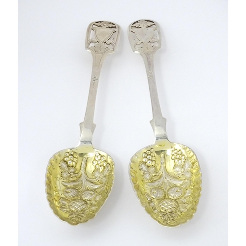 325 - A pair of William IV silver berry spoons with openwork detail to handles and gilded bowls, hallmarke... 