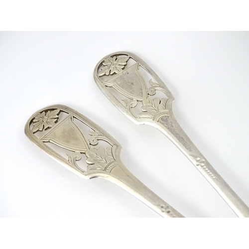 325 - A pair of William IV silver berry spoons with openwork detail to handles and gilded bowls, hallmarke... 