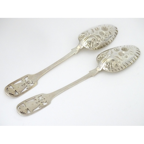 325 - A pair of William IV silver berry spoons with openwork detail to handles and gilded bowls, hallmarke... 