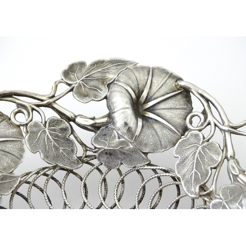 328 - A Victorian silver bon bon dish with floral and foliate decoration and swing handle, hallmarked Birm... 