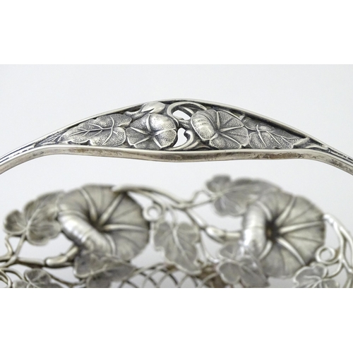 328 - A Victorian silver bon bon dish with floral and foliate decoration and swing handle, hallmarked Birm... 