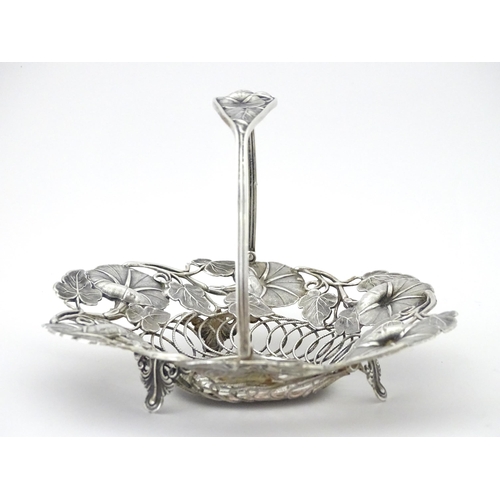 328 - A Victorian silver bon bon dish with floral and foliate decoration and swing handle, hallmarked Birm... 