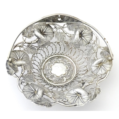 328 - A Victorian silver bon bon dish with floral and foliate decoration and swing handle, hallmarked Birm... 