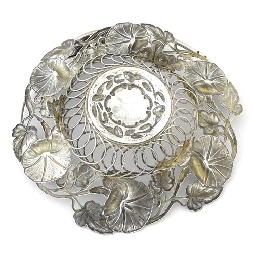 328 - A Victorian silver bon bon dish with floral and foliate decoration and swing handle, hallmarked Birm... 