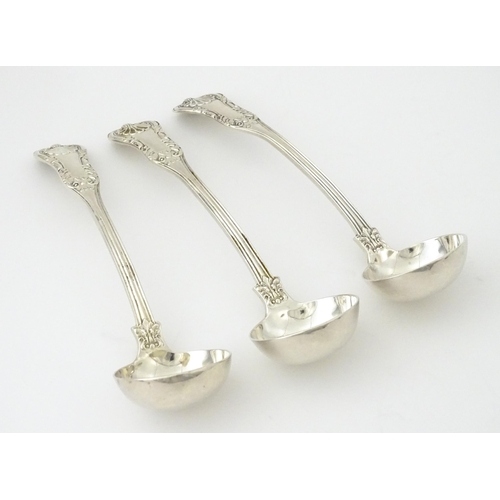 332 - Three 19thC Scottish silver King's pattern cream ladles hallmarked Glasgow 1830, maker WM AM. Approx... 