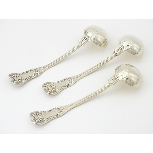 332 - Three 19thC Scottish silver King's pattern cream ladles hallmarked Glasgow 1830, maker WM AM. Approx... 