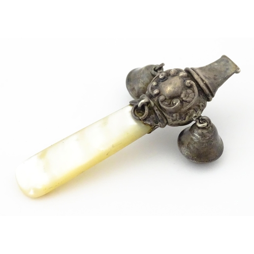 335 - A silver child's rattle with mother of pearl teether handle and whistle to one end, hallmarked Chest... 