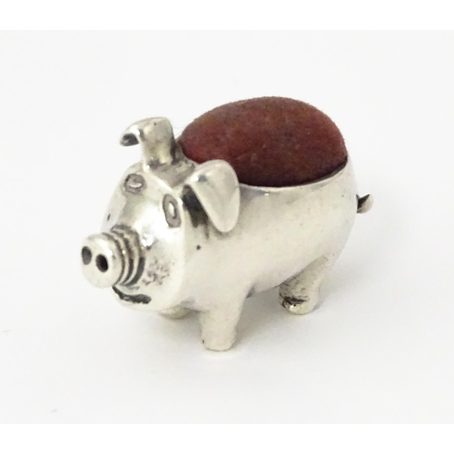 336 - A .925 sterling silver novelty pin cushion formed as a pig. Approx. 1