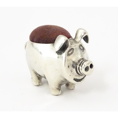 336 - A .925 sterling silver novelty pin cushion formed as a pig. Approx. 1