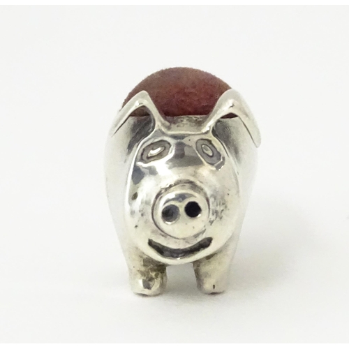 336 - A .925 sterling silver novelty pin cushion formed as a pig. Approx. 1