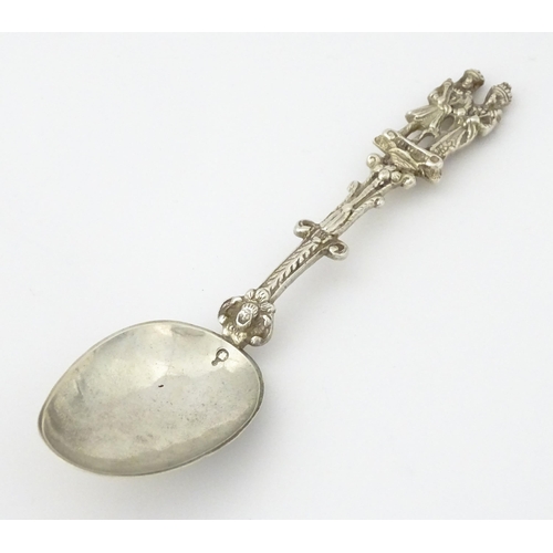 337 - A Dutch Export silver spoon surmounted by a figures. Approx. 7