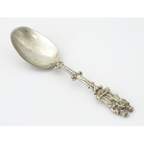 337 - A Dutch Export silver spoon surmounted by a figures. Approx. 7