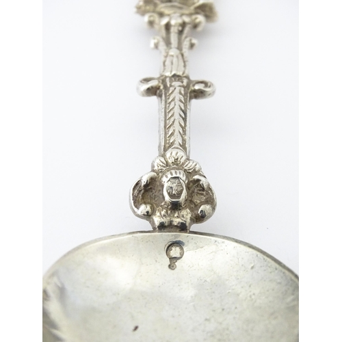 337 - A Dutch Export silver spoon surmounted by a figures. Approx. 7