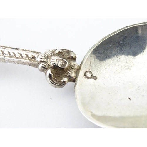 337 - A Dutch Export silver spoon surmounted by a figures. Approx. 7