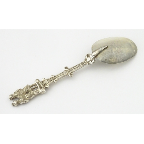 337 - A Dutch Export silver spoon surmounted by a figures. Approx. 7