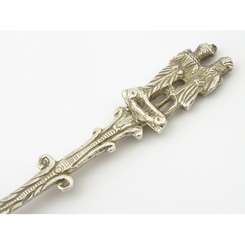 337 - A Dutch Export silver spoon surmounted by a figures. Approx. 7