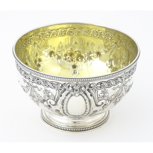 339 - A Victorian silver bowl with floral swag detail hallmarked Sheffield 1869, maker Martin Hall & Co. A... 