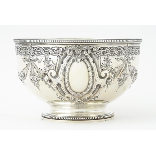 339 - A Victorian silver bowl with floral swag detail hallmarked Sheffield 1869, maker Martin Hall & Co. A... 