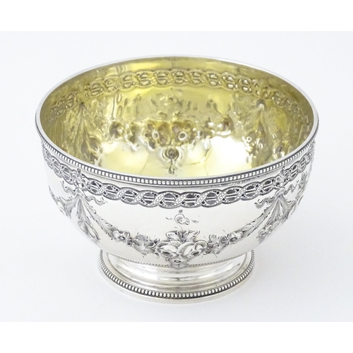 339 - A Victorian silver bowl with floral swag detail hallmarked Sheffield 1869, maker Martin Hall & Co. A... 