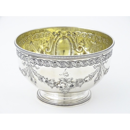 339 - A Victorian silver bowl with floral swag detail hallmarked Sheffield 1869, maker Martin Hall & Co. A... 