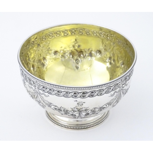 339 - A Victorian silver bowl with floral swag detail hallmarked Sheffield 1869, maker Martin Hall & Co. A... 