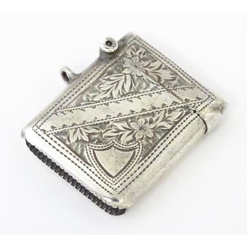 342 - A silver vesta case with engraved decoration, hallmarked Birmingham 1903, maker Arthur Cook. Approx.... 