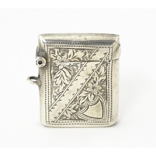 342 - A silver vesta case with engraved decoration, hallmarked Birmingham 1903, maker Arthur Cook. Approx.... 