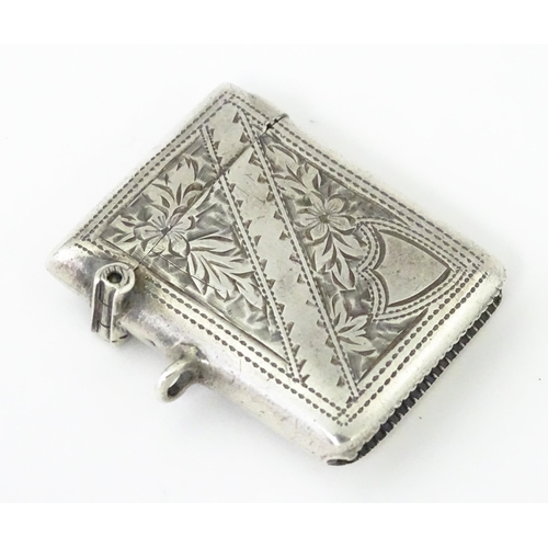 342 - A silver vesta case with engraved decoration, hallmarked Birmingham 1903, maker Arthur Cook. Approx.... 