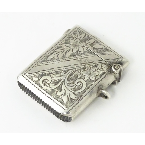 342 - A silver vesta case with engraved decoration, hallmarked Birmingham 1903, maker Arthur Cook. Approx.... 