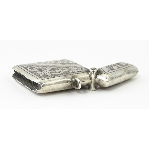 342 - A silver vesta case with engraved decoration, hallmarked Birmingham 1903, maker Arthur Cook. Approx.... 