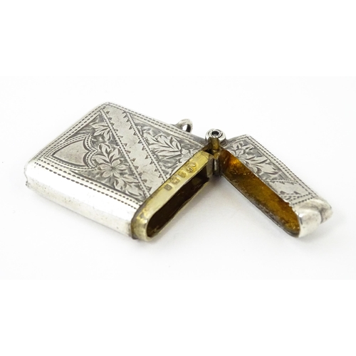 342 - A silver vesta case with engraved decoration, hallmarked Birmingham 1903, maker Arthur Cook. Approx.... 