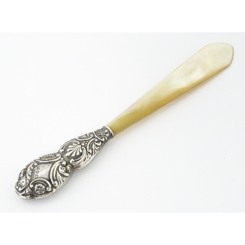 345 - A Victorian silver and mother of pearl letter opener hallmarked Birmingham 1899, maker G. E. Walton ... 