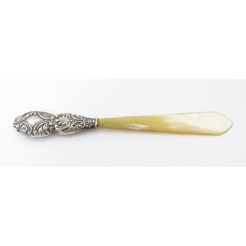 345 - A Victorian silver and mother of pearl letter opener hallmarked Birmingham 1899, maker G. E. Walton ... 