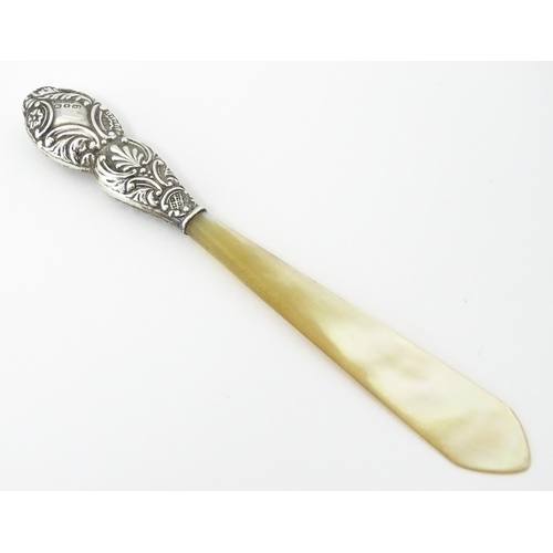 345 - A Victorian silver and mother of pearl letter opener hallmarked Birmingham 1899, maker G. E. Walton ... 