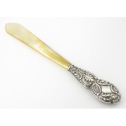 345 - A Victorian silver and mother of pearl letter opener hallmarked Birmingham 1899, maker G. E. Walton ... 