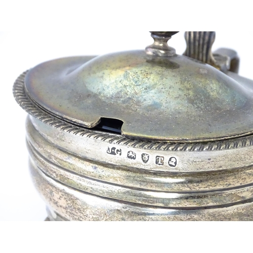 348 - A George III silver mustard pot with blue glass liner hallmarked London 1814, maker Jeremiah Garfiel... 