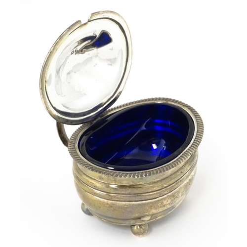 348 - A George III silver mustard pot with blue glass liner hallmarked London 1814, maker Jeremiah Garfiel... 